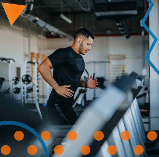 man running on treadmill in empty gym