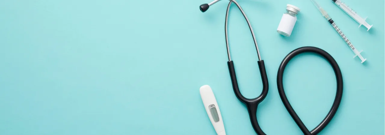 blue background with flatlay of medical equipment