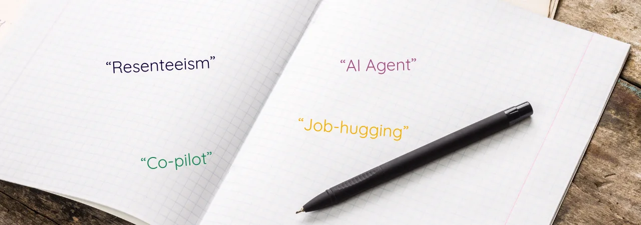 An image of a black notebook with key terms on the page "AI AGENT" "JOB HUGGING" "