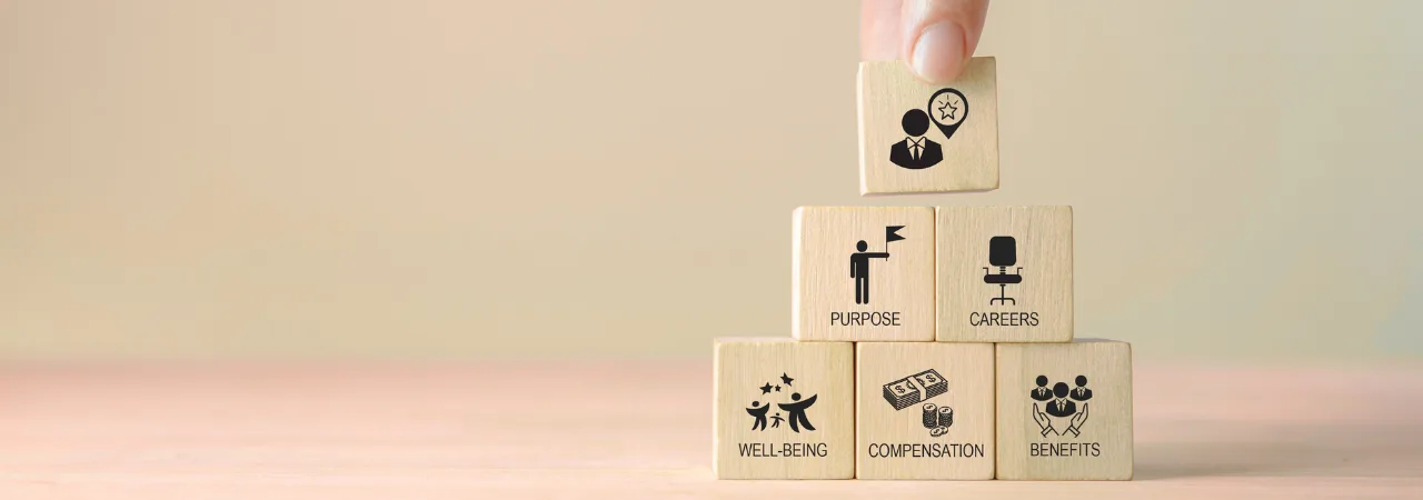 a plain background with 6 blocks stacked representing employee wellbeings